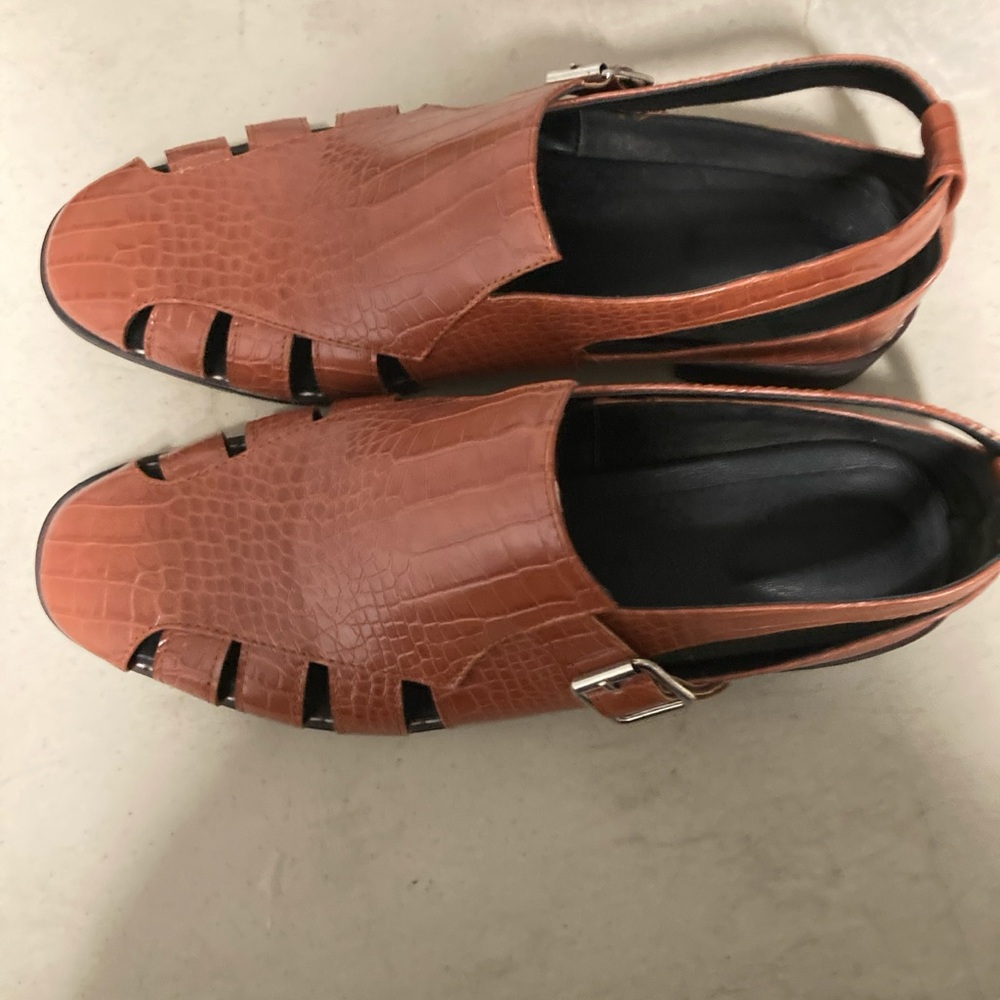 men’s brown and black leather shoes